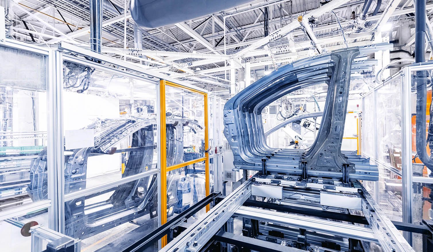 A factory with a production line, illustrating modern lighting in the automotive industry