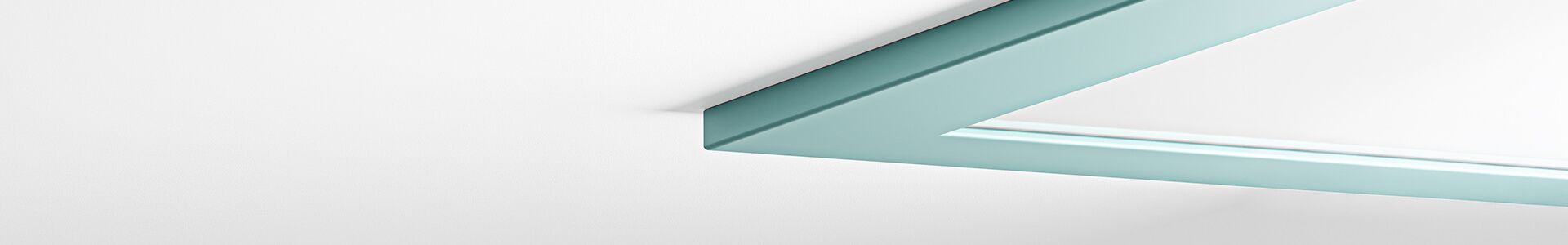 A Lumedic lamp with a turquoise frame on a white wall, providing suitable lighting in medical facilities